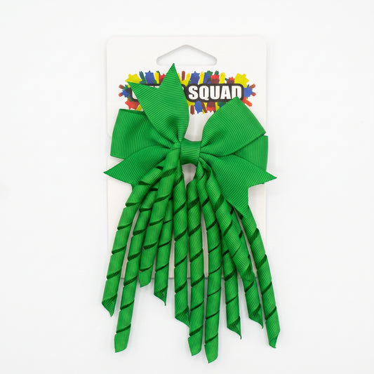 Green grosgrain korker hair bow with spiral ribbon tails on card